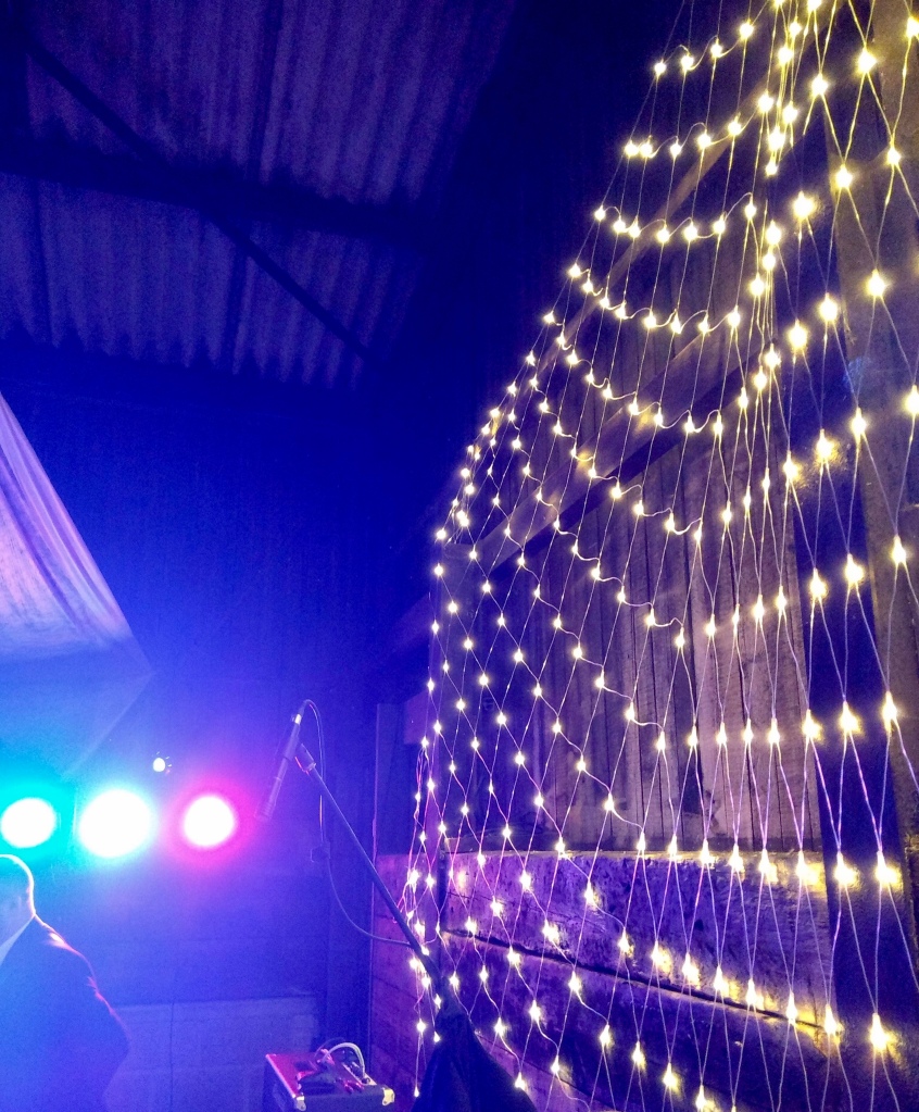 Fairy lights at a wedding in a barn 